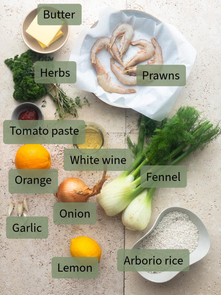 Ingredients for making prawn and saffron risotto from top: butter, herbs, prawns, tomato paste, white wine, orange, fennel, onion, garlic, lemon and arborio rice.