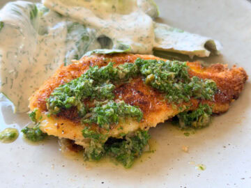 Crispy chicken cotoletta topped with fresh salsa verde served with a cos salad with creamy dill dressing.