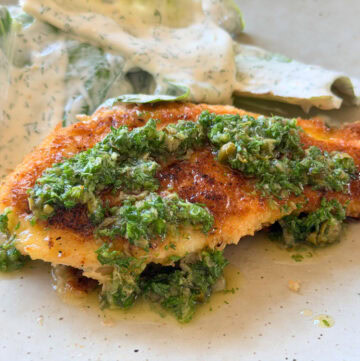 Crispy chicken cotoletta topped with fresh salsa verde served with a cos salad with creamy dill dressing.